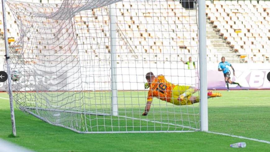 CS Constantine goalkeeper Zakaria Bouhalfaya pictured yesterday failing to stop a shot from Simba SC winger Kibe Denis (not in picture) during their CAF Confederation Cup Group A match at the Benjamin Mkapa Stadium.