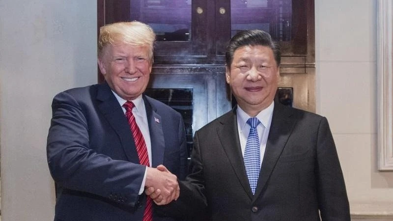 In this Dec 1, 2018, file photo, Chinese President Xi Jinping (right) shakes hands with the then US President Donald Trump in Buenos Aires, Argentina. 