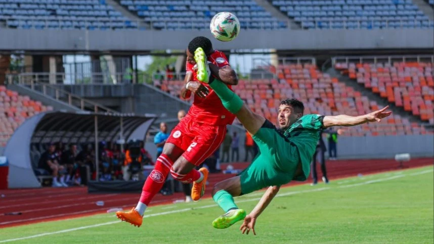 Simba SC wingback Shomari Kapombe is fouled by a CS Constantine defender during their CAF Confederation Cup Group A clash at Benjamin Mkapa Stadium on Sunday. Simba emerged victorious with a 2-0 win.