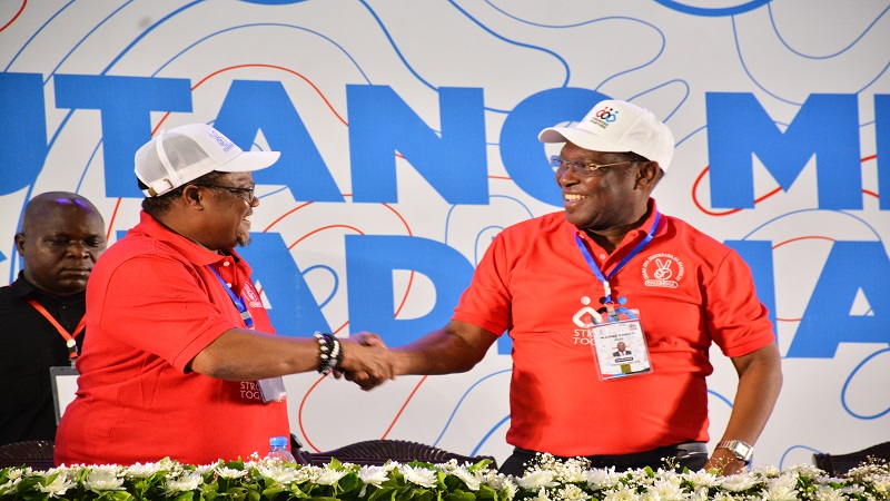 The opposition Chadema party National Chairman Freeman Mbowe (R) greets the Mainland Vice Chairman, Tundu Lissu, shortly before the elections during the party's General Meeting in Dar es Salaam yesterday. 