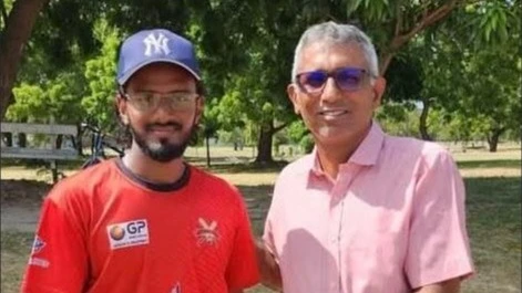 The Lions A team cricketer Umar Shaikh (L) gets the Player of the Match prize from Tanzania Cricket Association (TCA)'s Ayzaz Jassani once the former's team faced Gymkhana in the 2024 TCA DC Super League tie at Dar es Salaam Gymkhana Club venue early.