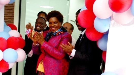 Minister for Health, Jenista Mhagama (C), claps shortly after inaugurating the Jakaya Kikwete Cardiac Institute (JKCI) clinic at Oysterbay branch in Dar es Salaam yesterday. Left is the JKCI Executive Director Dr. Peter Kisenge. 