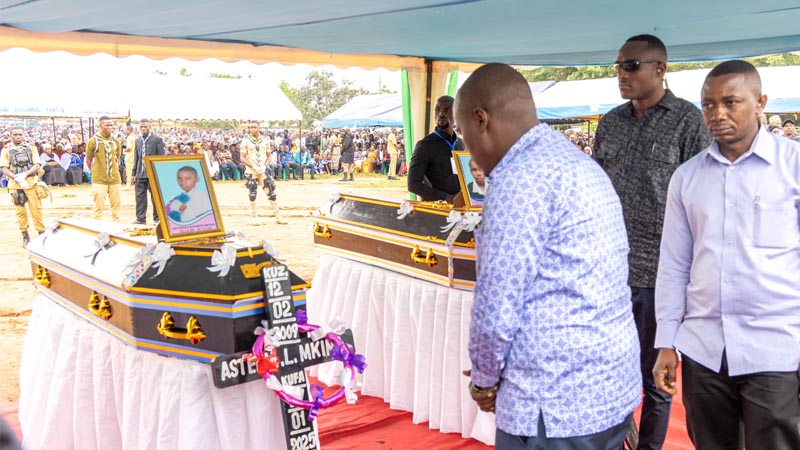 Deputy Prime Minister and Minister for Energy, Dr Doto Biteko leads mourners to pay last respect to the bodies of seven pupils of Businda Secondary School who passed away after being struck by lightning in Bukombe District, Geita Region yesterday.