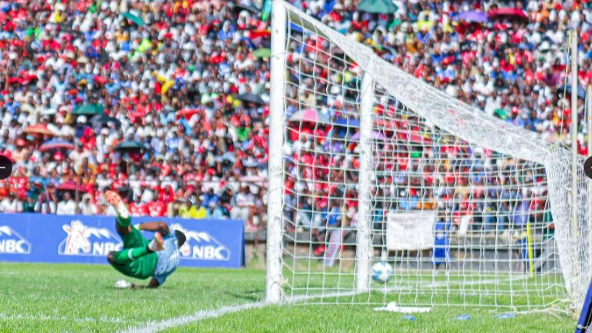 
Tabora United goalkeeper Jean Amonome fails to stop a long-distance shot from Simba striker Leonel Ateba (not in picture) to register his first goal during their Premier League match at Ali Hussein Mwinyi Stadium in Tabora. 