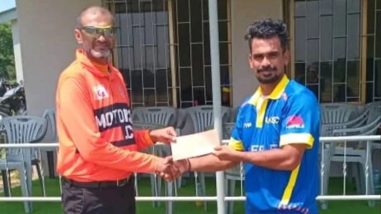 Aga Khan SC's Sivaraj Selvaraj (R) gets the Player of the Match prize from match umpire Adil Kassam after the completion of the club's 2025 Tanzania Cricket Association (TCA) DC Super League clash versus Pak Stars A in Dar es Salaam recently. 