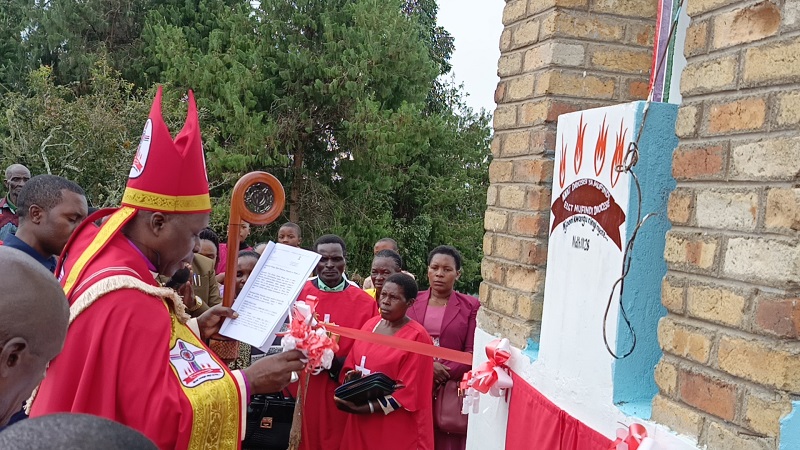 Bishop Dr Antony Kipangula of the Evangelical Lutheran Church in Tanzania (ELCT) Mufindi Diocese cuts the ribbon to officially inaugurate the church’s Tumaini District at Kibao village, Mtwango Ward in Mufindi District, Iringa Region over the weekend