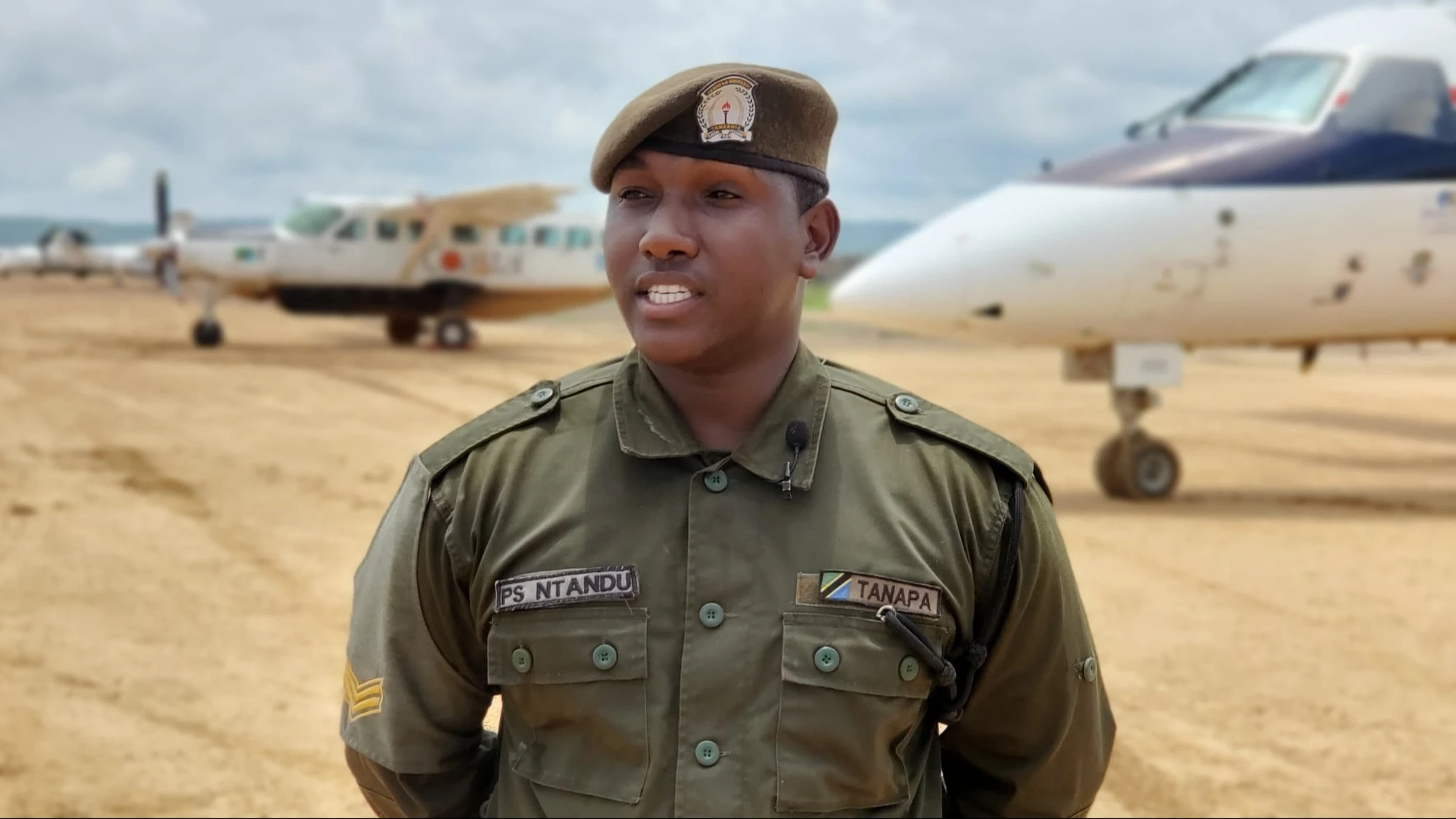 
Paskari Ntandu, Conservation Ranger II (CR II) at the Mikumi National Park explains to the journalists on an ongoing implementation for the expansion and upgrading of the Kikoboga Airstrip located inside the park