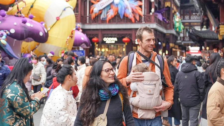 A French couple Tristan and Anouk Masselin visit Yuyuan Garden area in east China's Shanghai, Feb. 1, 2025.