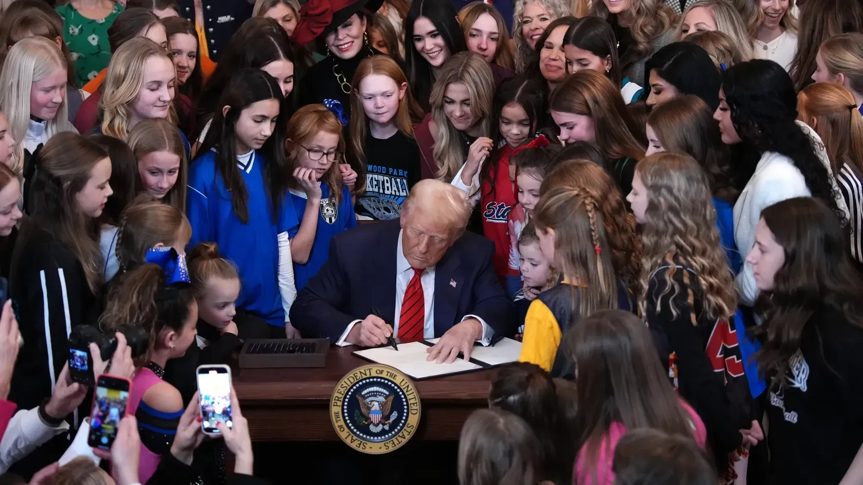 President Trump signed the "No Men in Women's Sports" executive order in the East Room at the White House on Wednesday. The order prohibits transgender women from competing in women's sports.