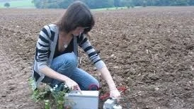 
Measuring soil respiration levels in a farm field. 