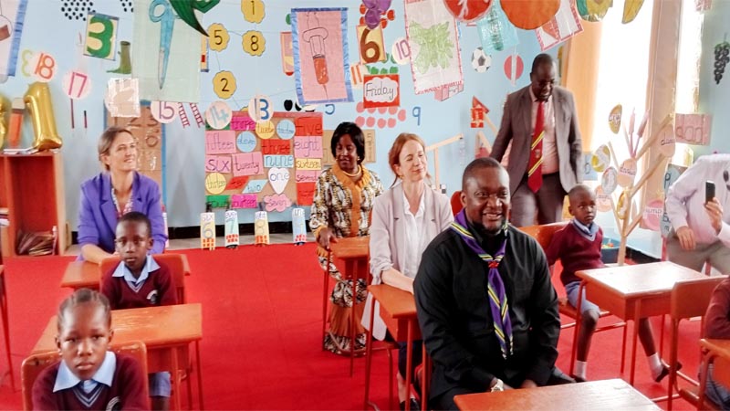 Mohamed Mchengerwa (in scarf), Minister of State in the President’s Office (Regional Administration and Local Governments), seated in a pre-school classroom at Bahi English Medium School in Bahi District, Dodoma Region, yesterday 