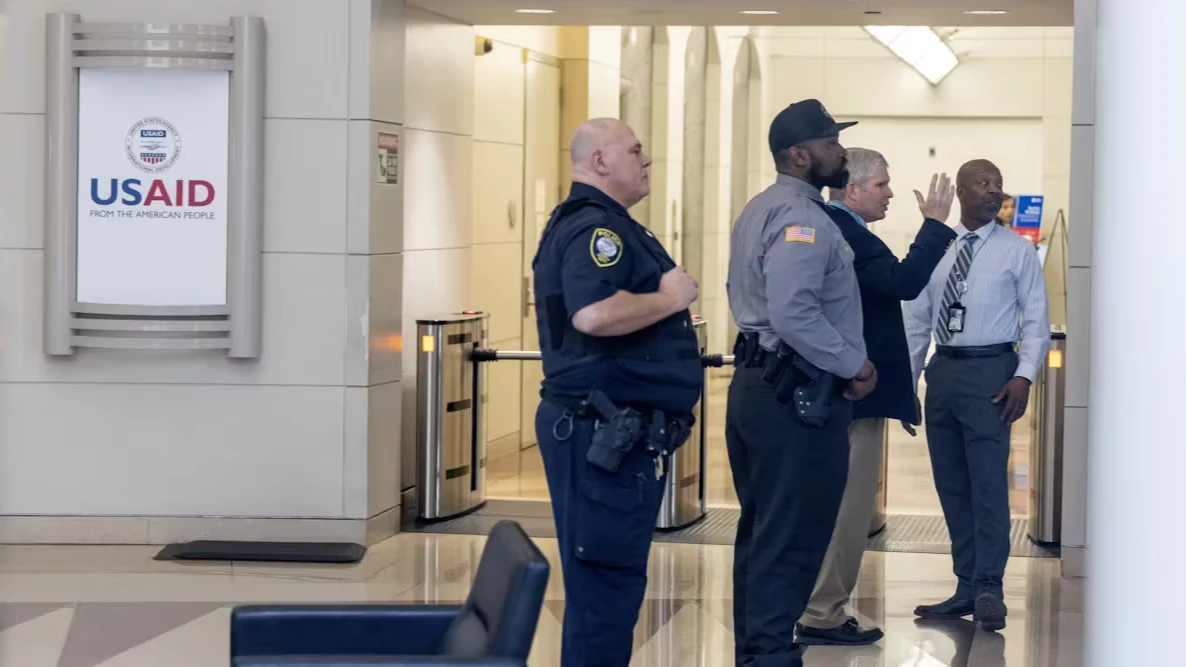 
Security personnel stand at a checkpoint in the lobby of the USAid headquarters in Washington DC after staffs were instructed to stay away.