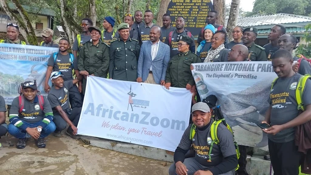  

The 2024 Twenzetu Kileleni expeditors pose in a photo at Machame Gate before starting the expedition to Uhuru Peak (second photo). 