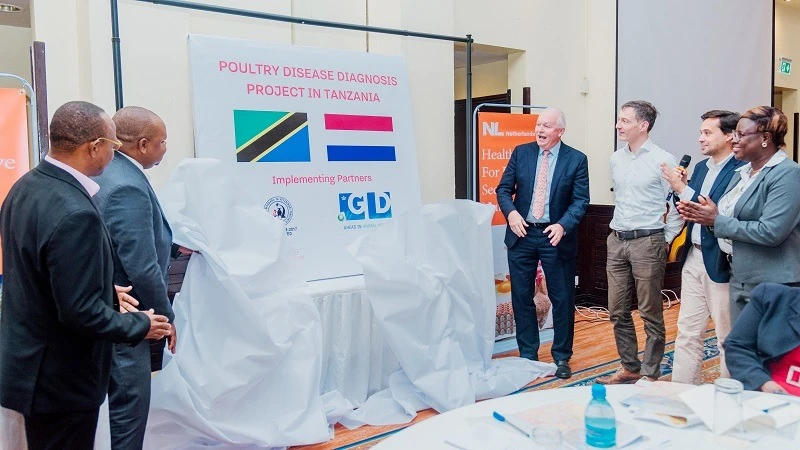 Prof Riziki Shemdoe (2nd-L), Permanent Secretary in the Livestock and Fisheries ministry, and the Ambassador of the Netherlands to Tanzania, Wiebe de Boer (4th-R), grace the launch of a poultry disease diagnosis programme in Dar es Salaam yesterday. 