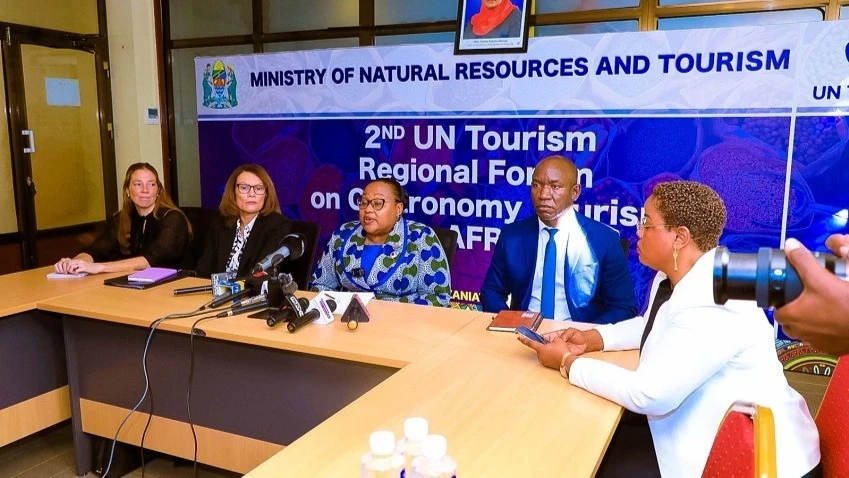 Natural Resources and Tourism minister Dr Pindi Chana (C) briefs journalists in Dar es Salaam yesterday on the upcoming (April 23-25) second United Nations Regional Forum on Gastronomy Tourism for Africa, to be held in Arusha city with over 300 people .