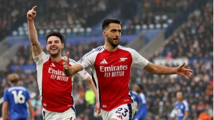 Arsenal's Mikel Merino celebrates scoring their first goal with Declan Rice during their Premier League match against Leicester at King Power Stadium, in Leicester, Britain on February 15, 2025