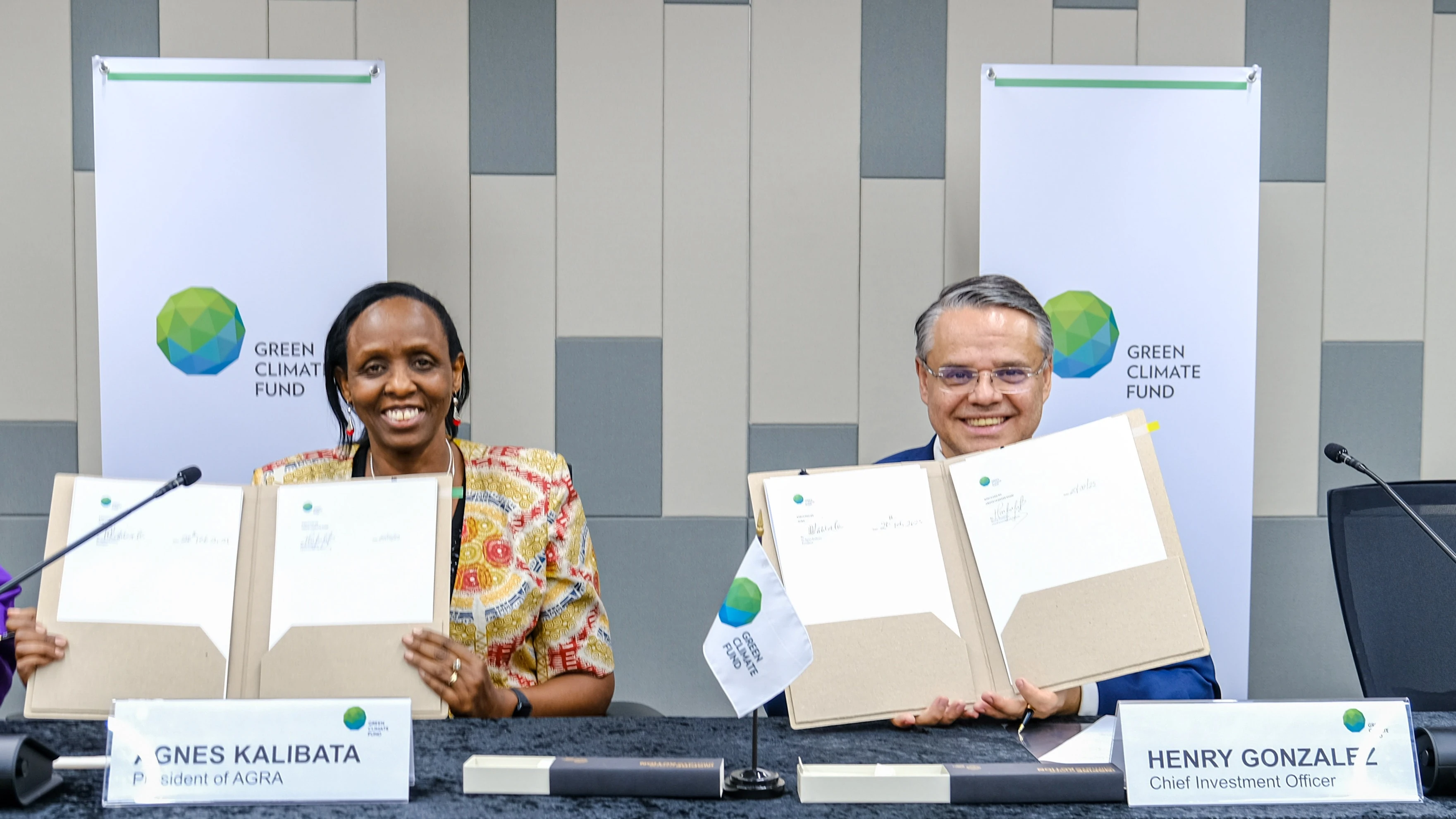 AGRA President Dr Agnes Kalibata (left) speaks after signing an agreement for financing on post-harvest loss management. On the right is Green Climate Fund Chief Investment Officer Henry Gonzalez