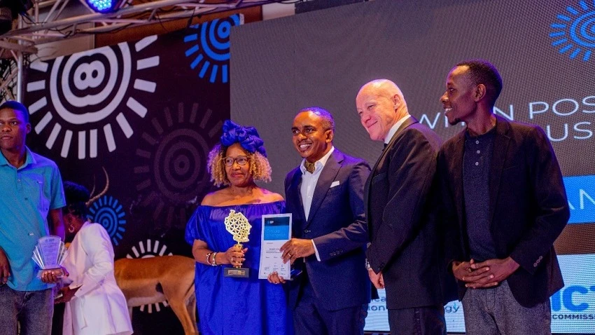 Minister of Communications and Information Technology Jerry Silaa, presenting awards to representatives of SEACOM Company which won the Best Carrier (Provider) Award in the sub-category of the TISPA Award for the Best Internet Connectivity Provider .