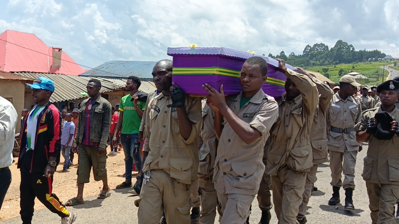 Militiamen of Luhunga village in Mufindi District, Iringa Region, carry a coffin with the body of their fellow Ezekiel Mgovano during the funeral yesterday. Mgovano passed away in a motorcycle accident after colliding with his colleague in the village. 