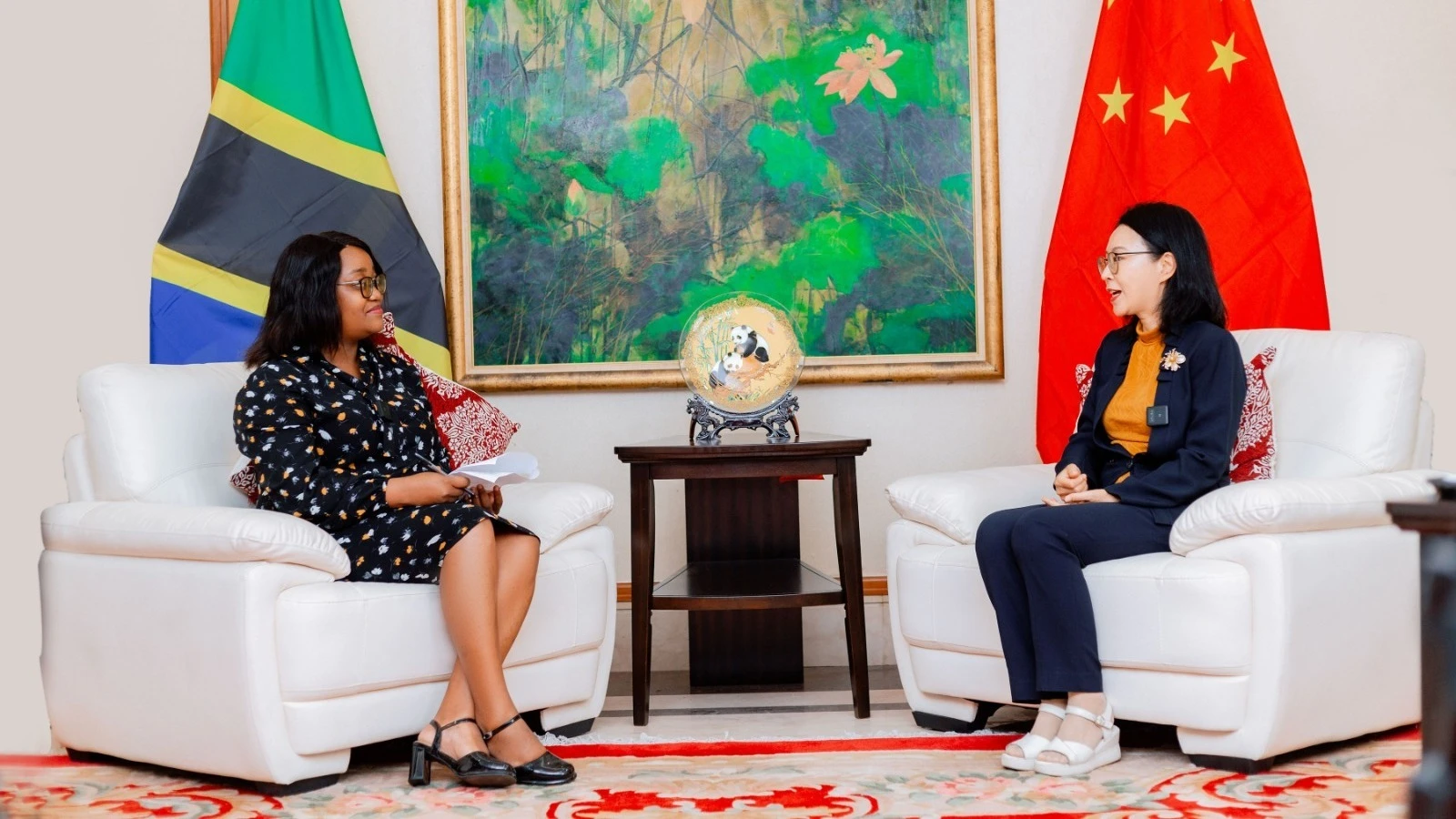 Chen Mingjian, (R), Chinese Ambassador to Tanzania, during an exclusive interview with The Guardian’s Reporter, Mary Kadoke, (L), in Dar es Salaam recently —where she shared key insights on the long-term China-Tanzania partnership and its growing impacts.