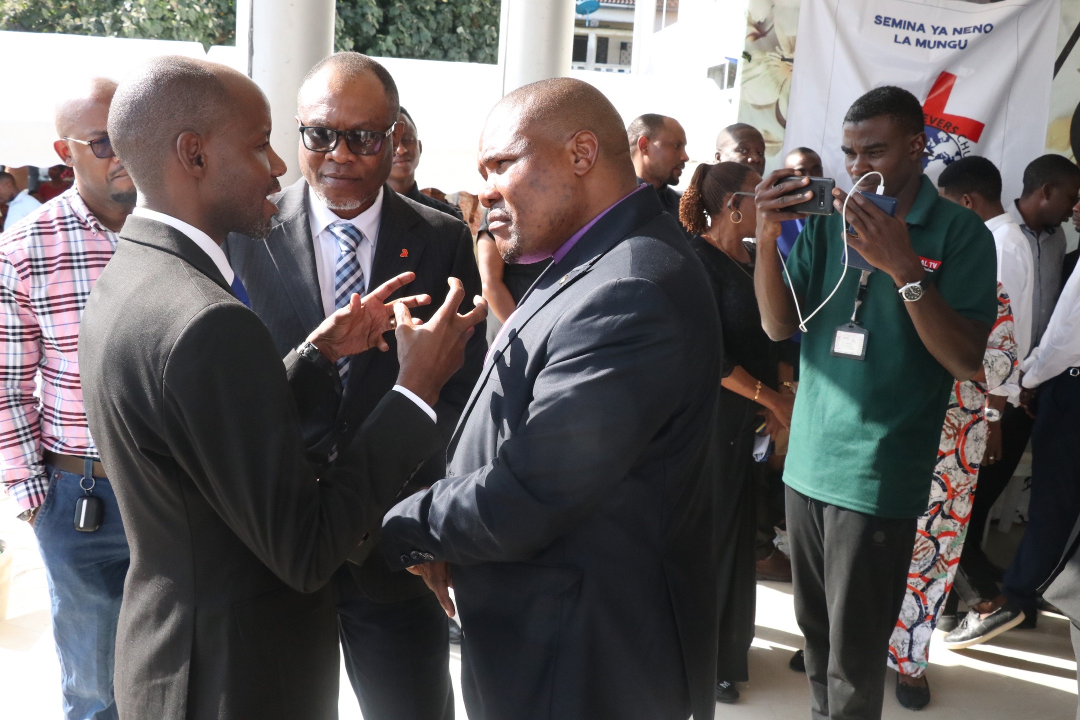  Ubungo district commissioner Albert Msando (L, gesturing), opposition Chadema deputy secretary general Amani Golugwa (to his left), and Glory of Christ Tanzania Church deputy secretary general Maximilian Machumu, exchange ideas yesterday.