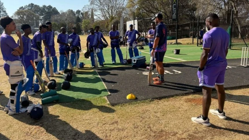Tanzania's senior national men's cricket squad's players listen to their coach, Salieg Nackerdien (2nd R), during a training in Pretoria, South Africa, recently.