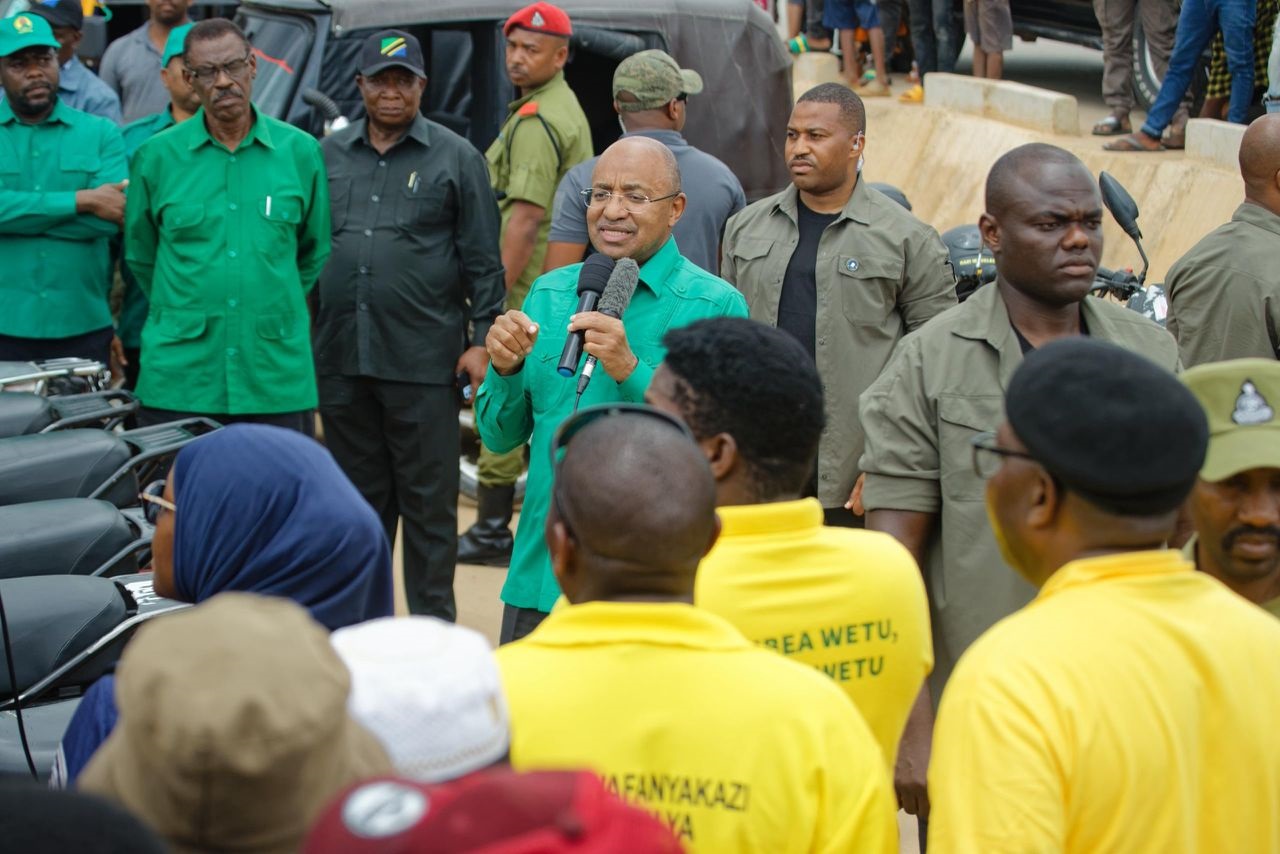 Dr Hussein Ali Mwinyi, CCM’s candidate for the Zanzibar Presidency come late October’s General Election, engages with members of Bodaboda Shehia group at Mndo in South Unguja Region in the course of his campaign rally yesterday. 