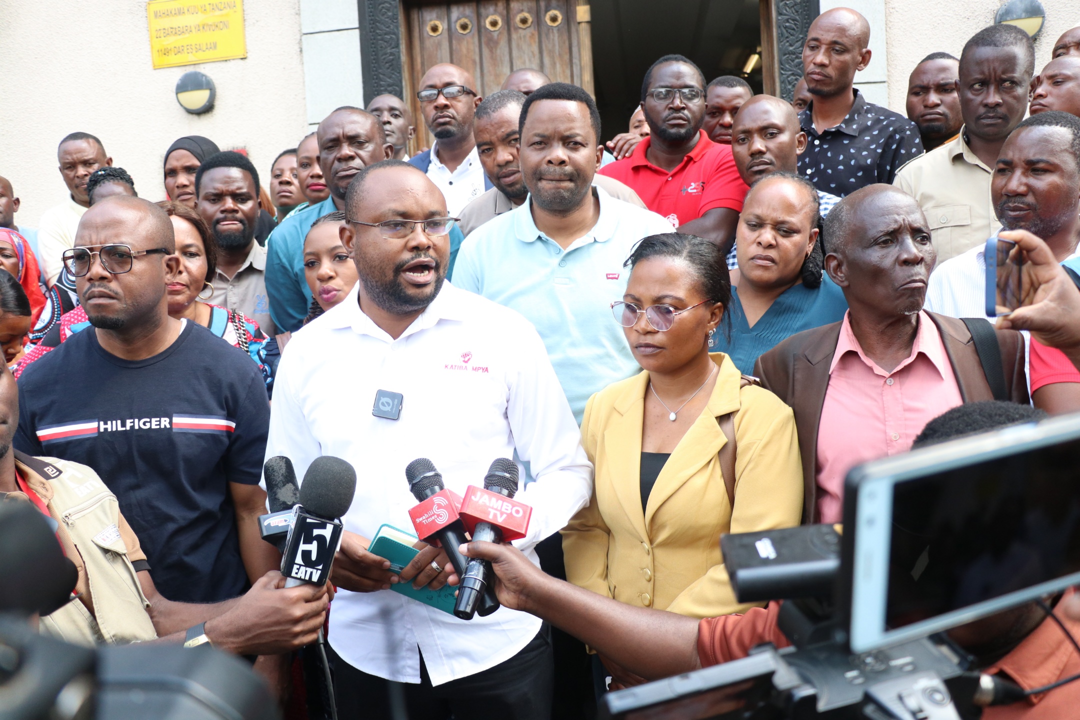 Chadema Secretary General John Mnyika briefed journalists outside Dar es Salaam High Court yesterday, saying they remained outside to push for their colleagues, who had been barred, to be allowed to follow Tundu Lissu's  treason trial 
