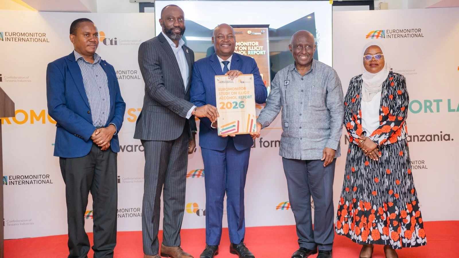 Deputy Minister of Industry and Trade, Hon. Dennis Londo (third from left), with key stakeholders at the launch of the Euromonitor report on the impact of illicit alcohol in Tanzania on the economy, public health, and consumers. 