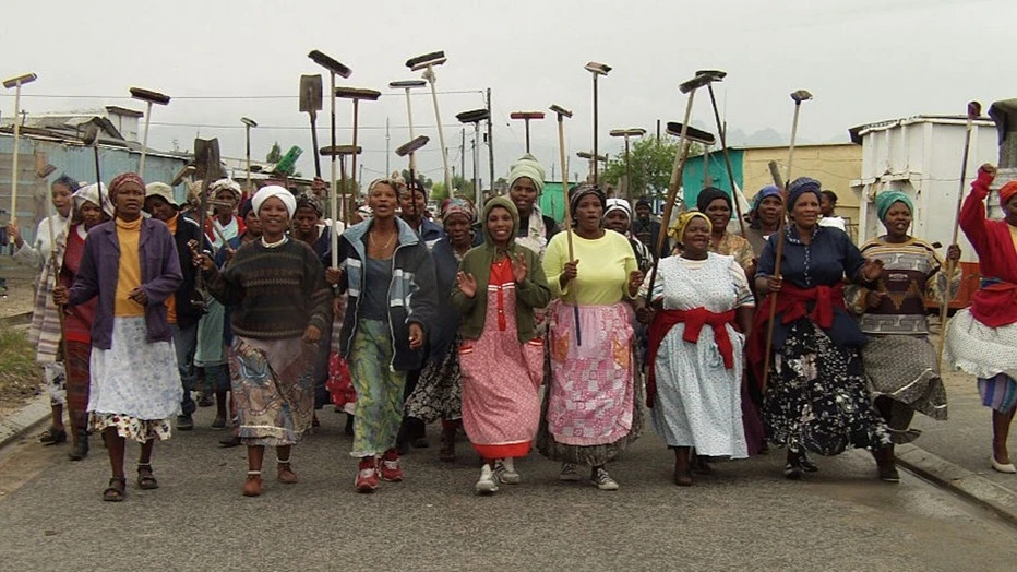Social grants can lead to greater community involvement. Women volunteers in Khayelitsha, Cape Town, meet weekly to sweep and clear rubbish off their streets.
