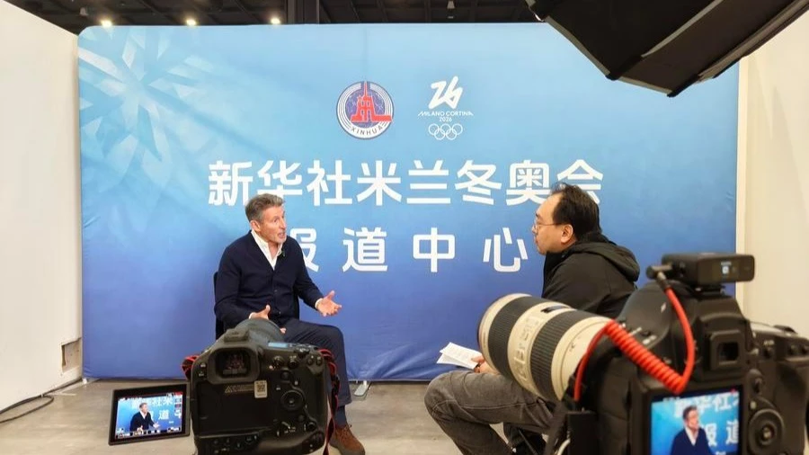 Sebastian Coe (L), head of World Athletics and an IOC member, speaks to Xinhua in Milan, Italy, Feb. 6, 2026.