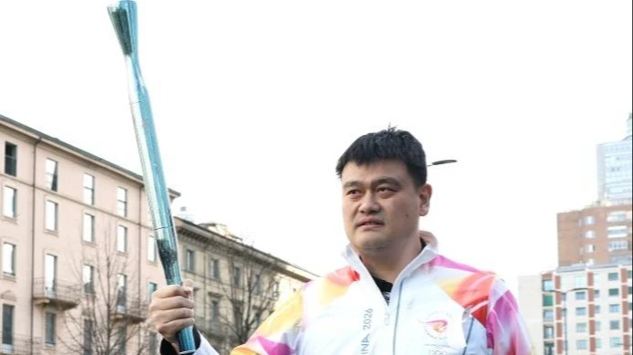 Former Chinese basketball legend Yao Ming relays the torch during the torch relay for 2026 Milan-Cortina Winter Olympics in Milan, Italy, Feb. 6, 2026. 