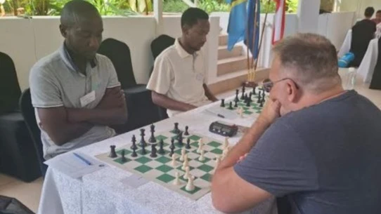Chess players in action during the Tanzania–Poland Friendship Chess Tournament held at the Polish Embassy in Tanzania. 