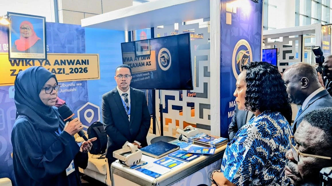 Waziri wa Mawasiliano na Teknolojia ya Habari, Angella Kairuki (kulia) akipokea maelezo kutoka kwa Afisa kutoka Mamlaka ya Mawasiliano nchini—TCRA (wa kwanza kushoto) 