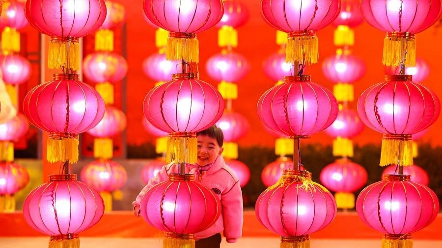 A child plays at a square in Jingning County, northwest China's Gansu Province, Feb. 13, 2026. China is alive with vibrant celebrations during the Spring Festival.