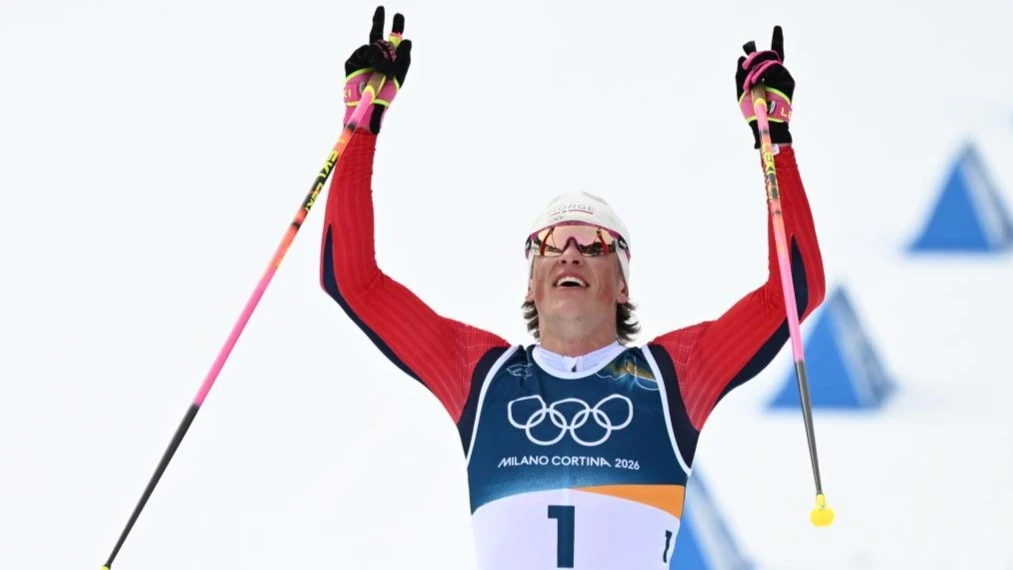 Johannes Hoesflot Klaebo of Norway celebrates after the cross-country skiing men's 50km mass start classic match at the Milan-Cortina 2026 Olympic Winter Games in Tesero, Italy, Feb. 21, 2026.